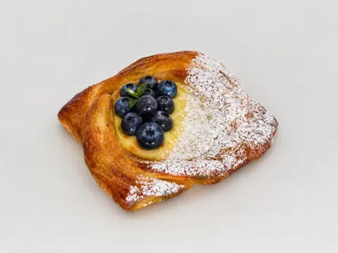 Baked Custard and fresh Blueberry Danish - Silky vanilla custard meets juicy blueberries inside golden, flaky layers. Sweet, creamy, and bursting with bright berry flavor.