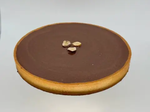 Big Crunchy Dark Chocolate Tart - Rich chocolate tart made for sharing. Crispy chocolate crust, a light nutty crunch, smooth chocolate filling, and a shiny glaze. Perfect for 6–8 people—great for gatherings, celebrations, or cozy moments with friends and family.