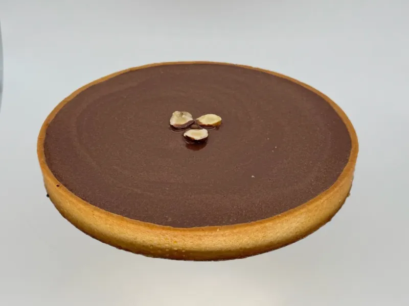 Big Crunchy Dark Chocolate Tart - Rich chocolate tart made for sharing. Crispy chocolate crust, a light nutty crunch, smooth chocolate filling, and a shiny glaze. Perfect for 6–8 people—great for gatherings, celebrations, or cozy moments with friends and family.