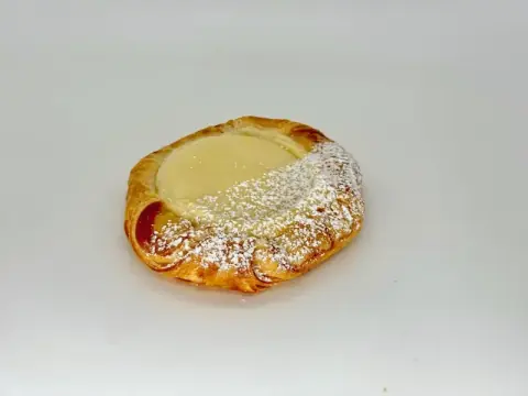 Baked Cheese Danish - Buttery laminated pastry baked to golden perfection and filled with rich Philadelphia cream cheese. Crispy on the outside, soft and creamy on the inside, this classic Danish is an indulgent treat for any time of day.