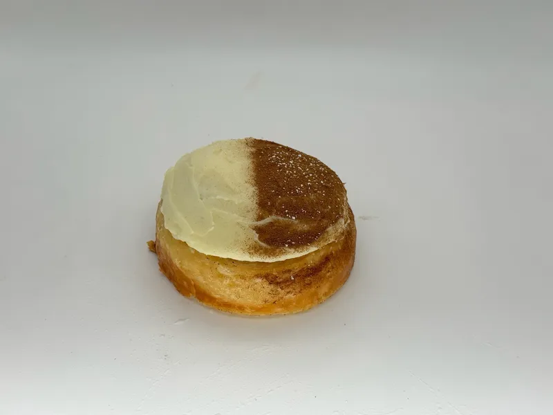 Croissabon - Our croissant–cinnamon roll hybrid. Flaky, buttery laminated layers spiraled around a gooey brown-sugar cinnamon swirl, baked until the edges caramelize and the center stays soft and molten. The crackle of a French croissant meets the warm, sticky comfort of a classic cinnamon roll. Also known as a morning bun.