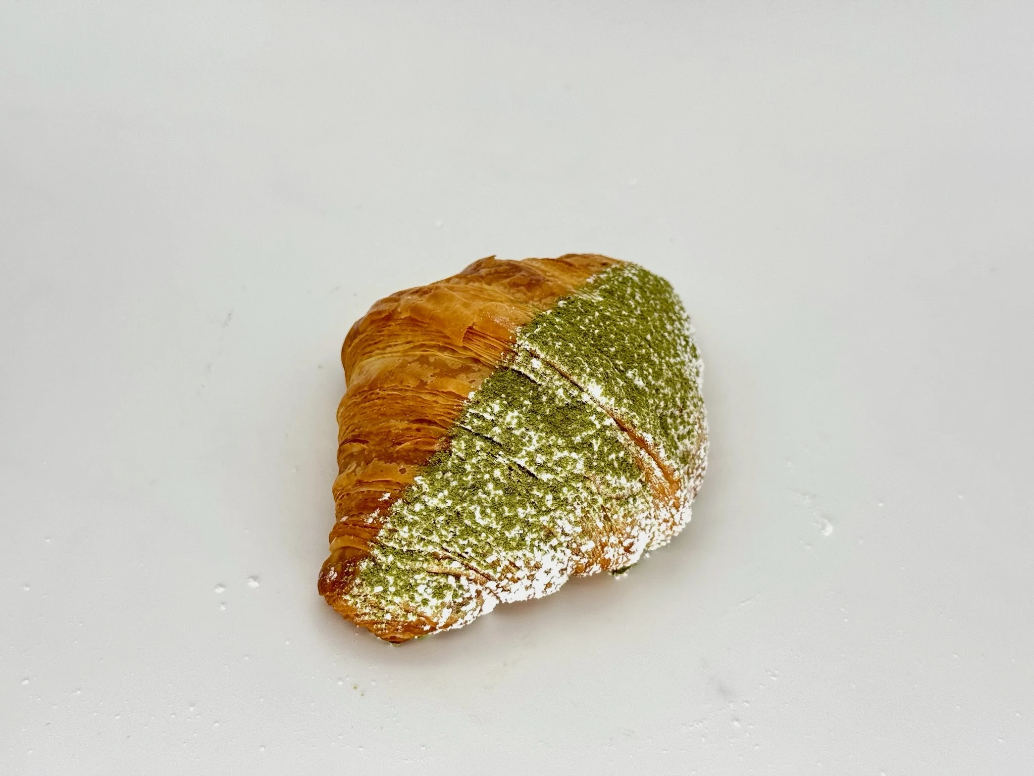 Matcha Cream Croissant - Flaky, buttery layers filled with silky matcha custard cream. Smooth. Addictive for all matcha lovers.