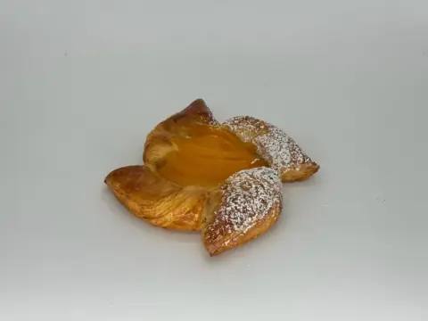 Peach Custard Danish - A golden pinwheel of flaky pastry filled with baked vanilla custard and crowned with tender, juicy peaches. Buttery, creamy, and sun-kissed sweet.