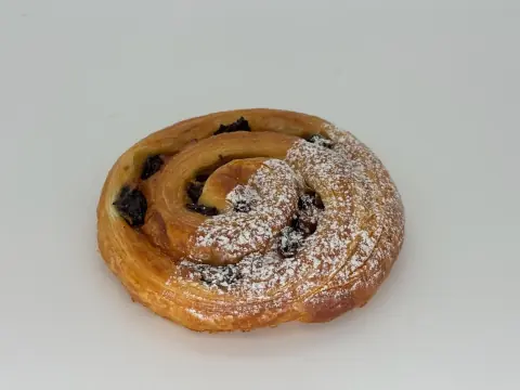 Raisin Custard Danish - Swirled with silky vanilla custard and plump rum-soaked raisins, baked into golden, flaky spirals. Warm, aromatic, and deeply comforting.