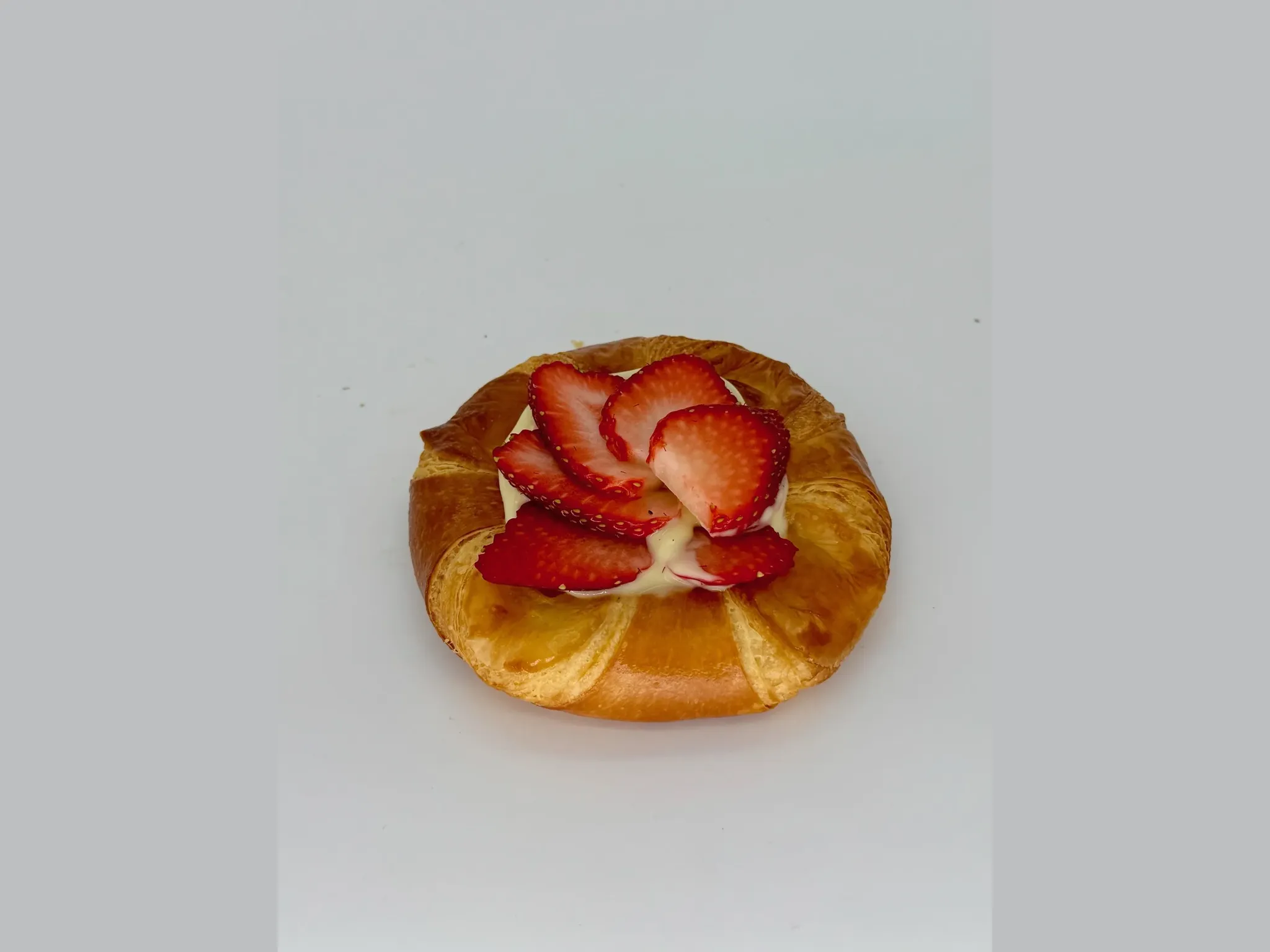 Crème Danish with Fresh Strawberries - Golden, flaky pastry finished with smooth vanilla crème piped fresh after baking and topped with vibrant, juicy strawberries. Light, creamy, and beautifully fresh.