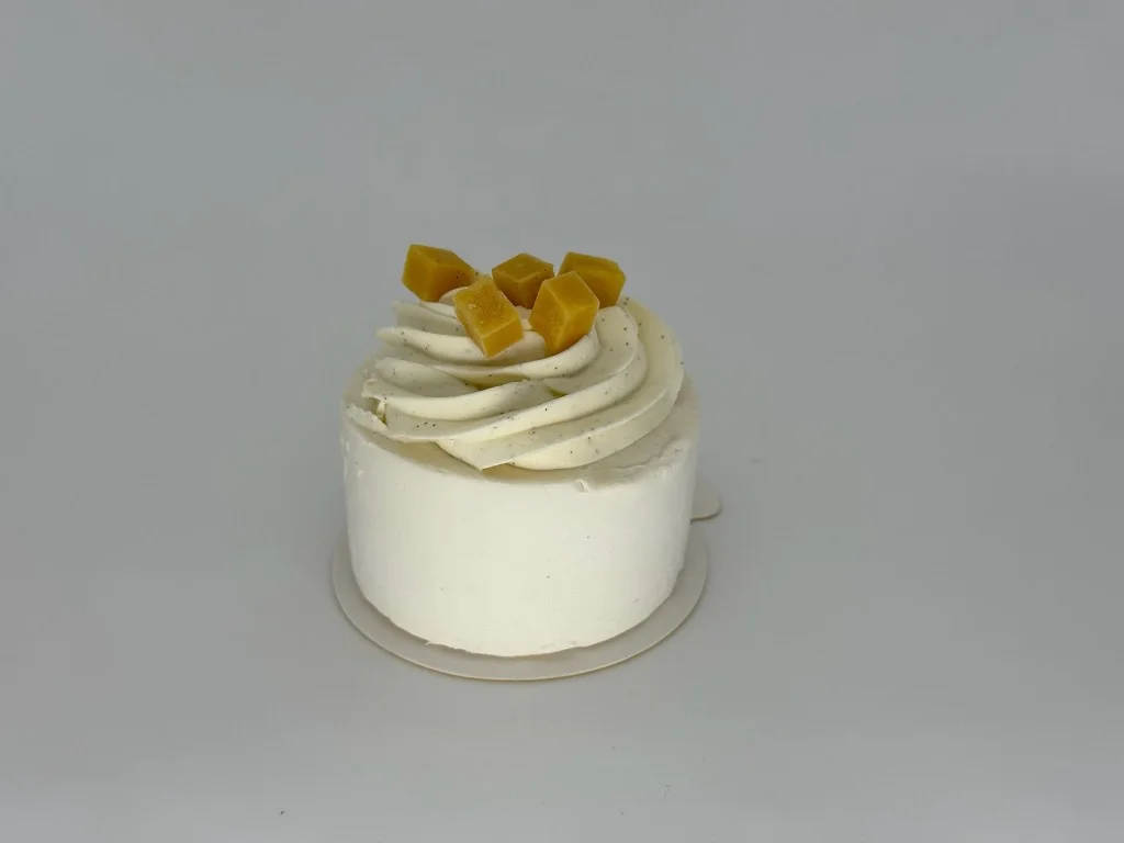 Tropical Mango Coconut Mousse Cake - Light coconut cream mousse with a vibrant mango confit and silky mango ganache center, layered over delicate pain de Gênes sponge and a crisp sablé base.